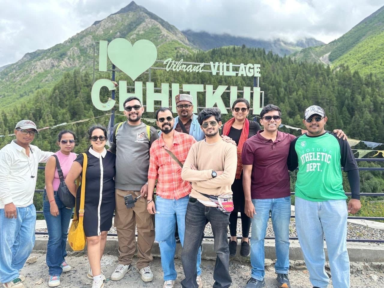 A Gear & Adventure group at the Chitkul sign