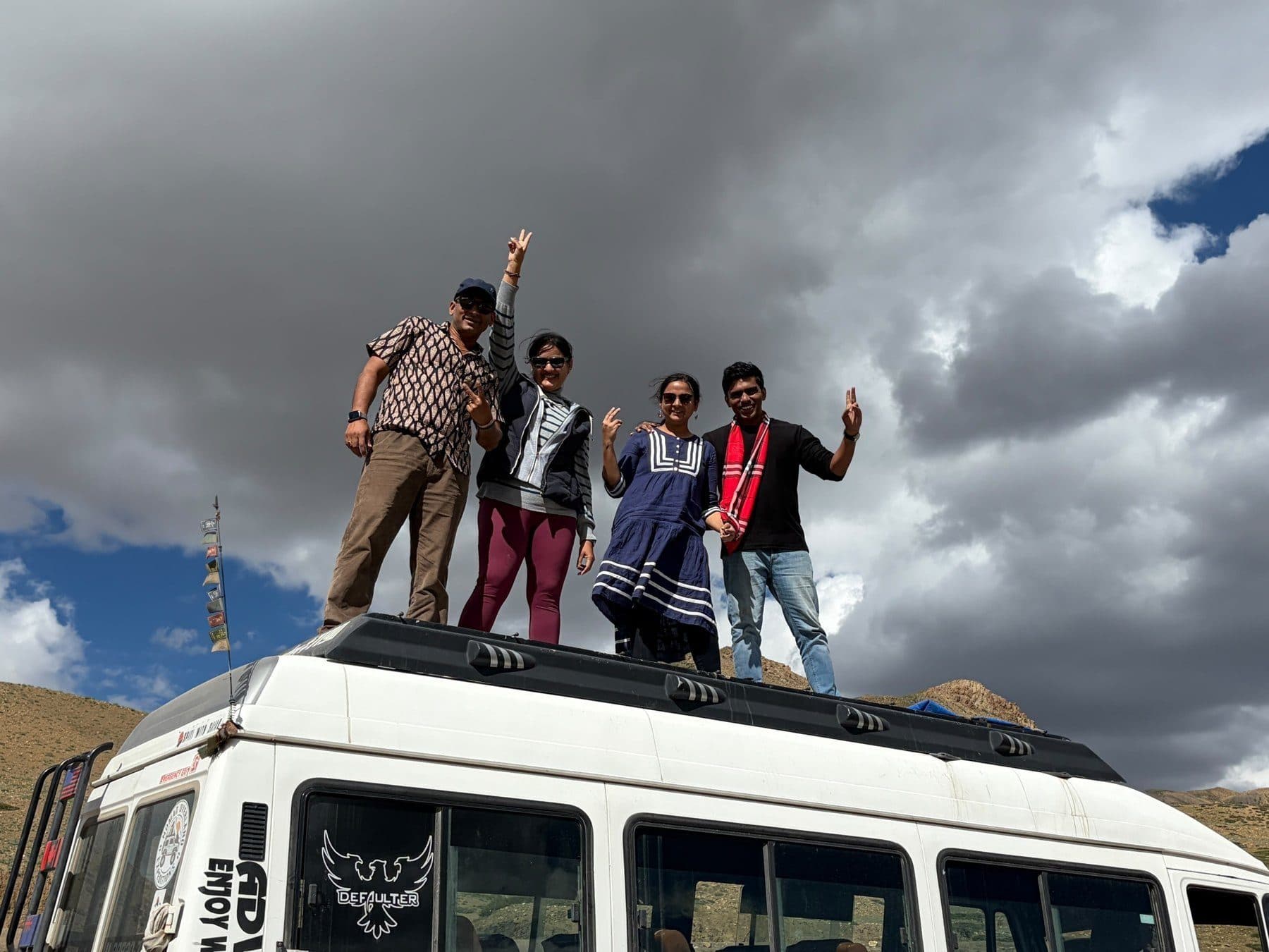 Travellers on the roof of the Tempo Traveller