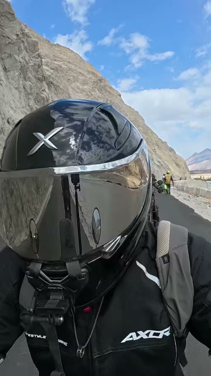 A rider on the Shyok road in Ladakh, mountains ahead